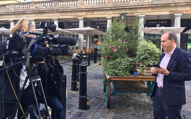 Journalist delivering news broadcast