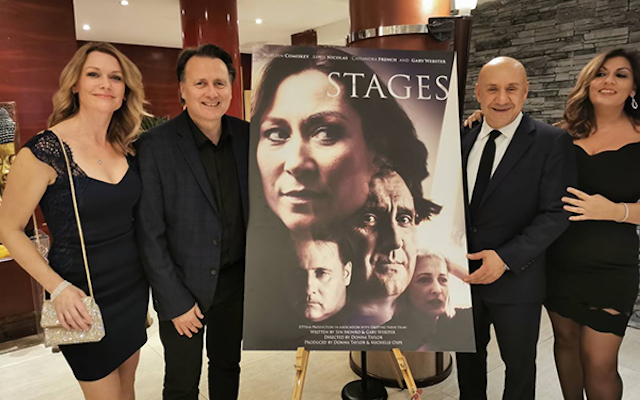 The cast and crew of the film 'STAGES' stand aside the film poster