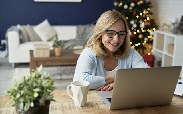Woman having video conference during Christmas at home