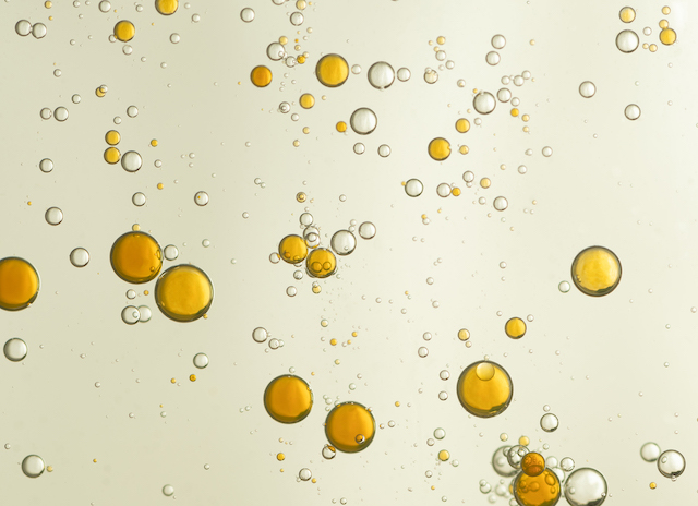 Small droplets appear in liquid.