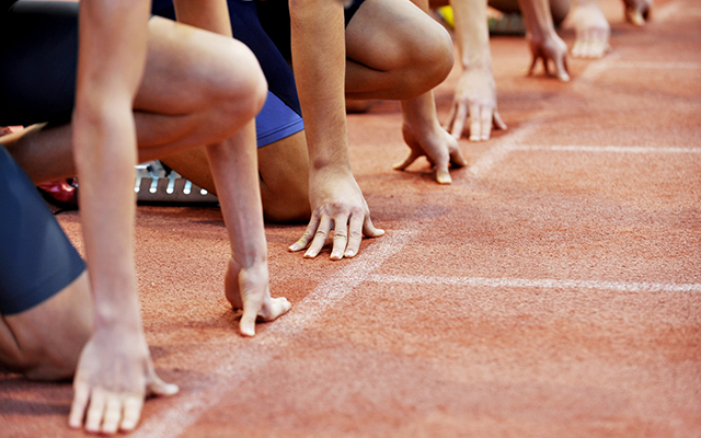 Athletes at the sprint start line in track and field