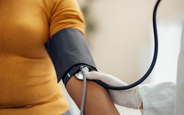 a person having their blood pressure taken