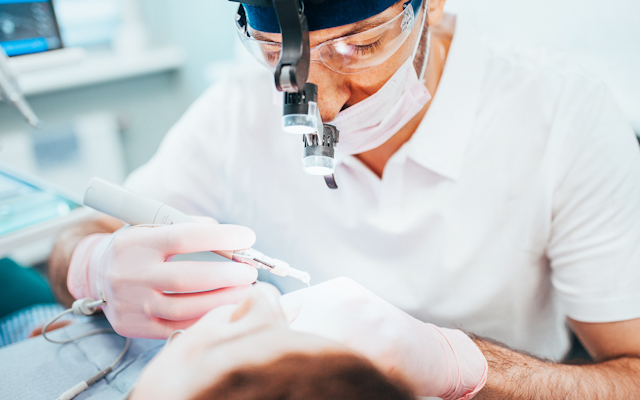 Dentist working on patient