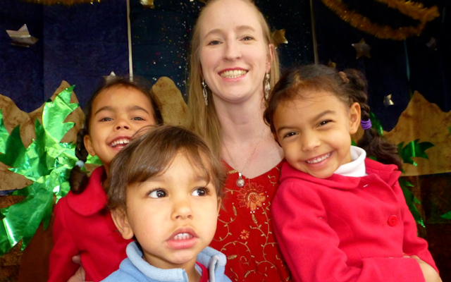 Christine with her kids at preschool Christmas event in Peru