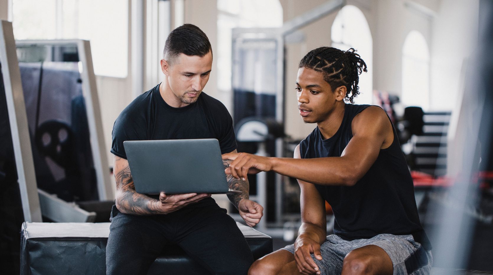 Personal trainer looking at exercise and Parkinson's resources