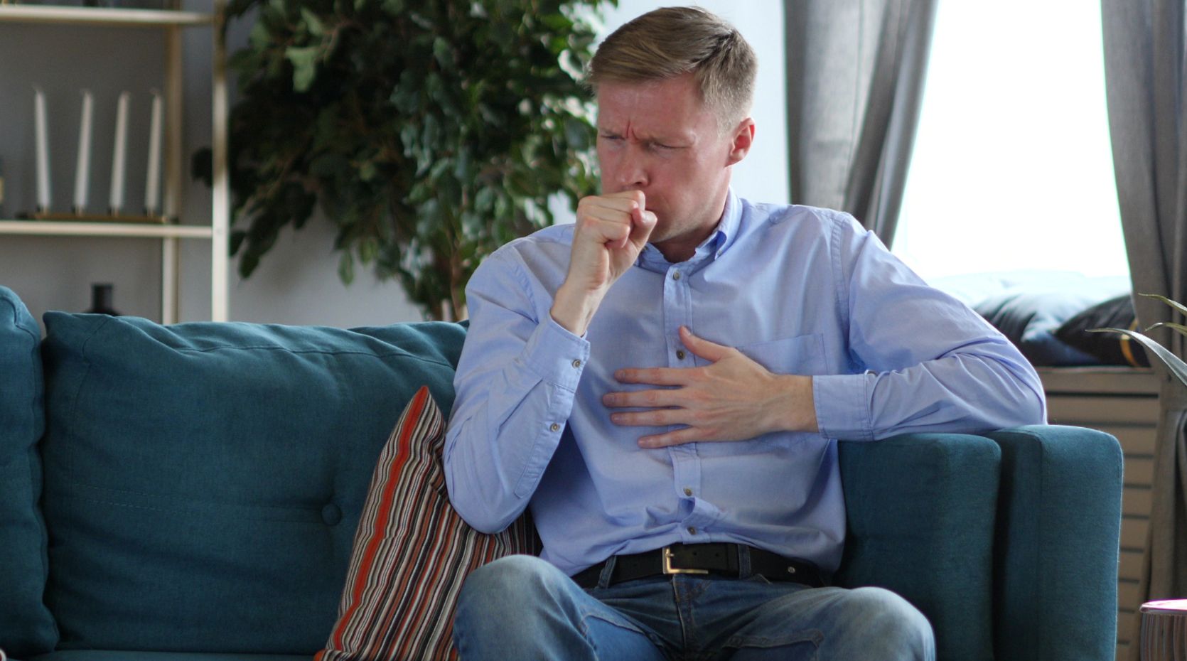 A photo of a person coughing to represent Parkinson's and coughing