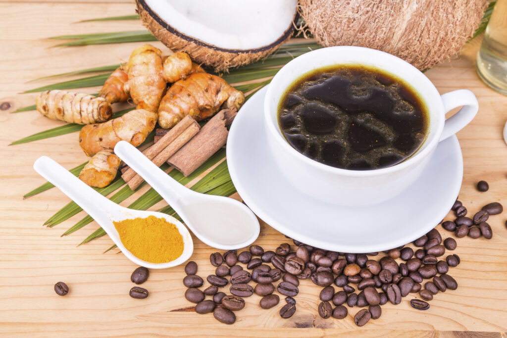 Bulletproof coffee blended with virgin coconut oil, turmeric, cl
