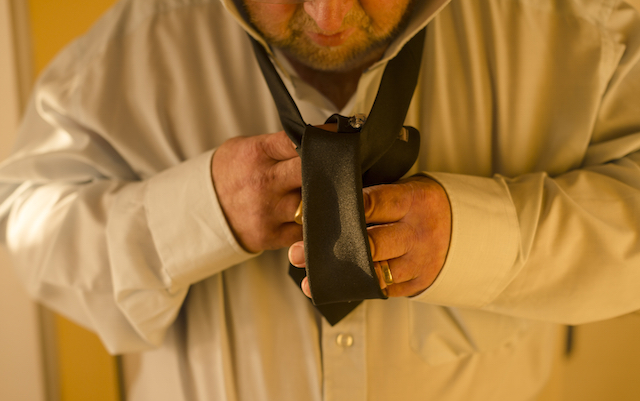 Putting on a tie can often be difficult for people with Parkinson's