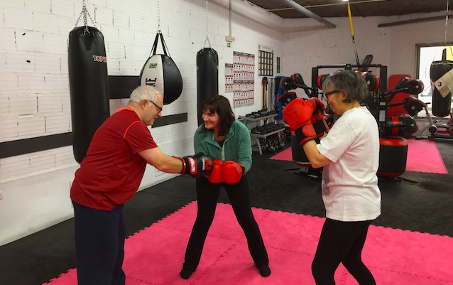 Members of a Parkinson's movement clinic boxing.