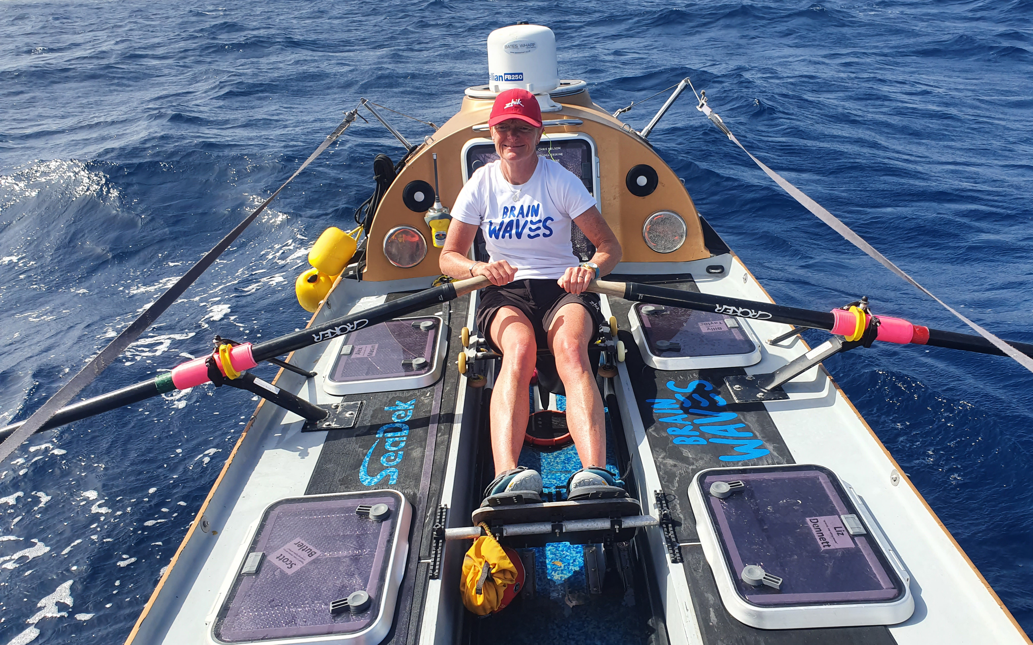 Liz Dennett rowing in the ocean
