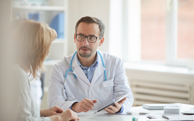 Male doctor with nurse at office