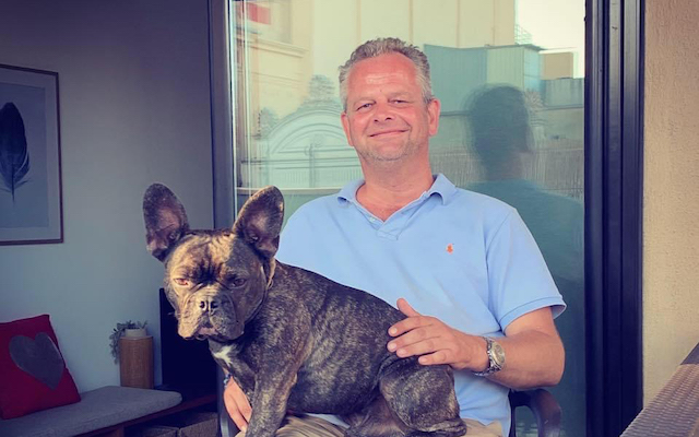 Wytze Russchen smiles for a photo with his dog.