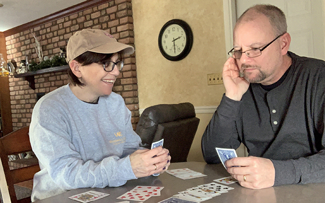 Lori DePorter and her husband Mike playing Gin Rummy