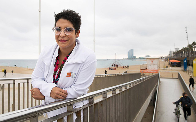 Dr Lucía Ferro poses for a portrait on the beach.