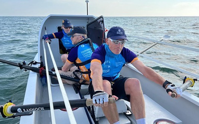 Gary Shaughnessy dressed in rowing attire, rowing across the channel