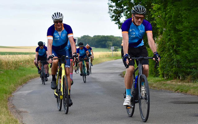 Gary Shaughnessy cycling through the countryside with a group of cyclists