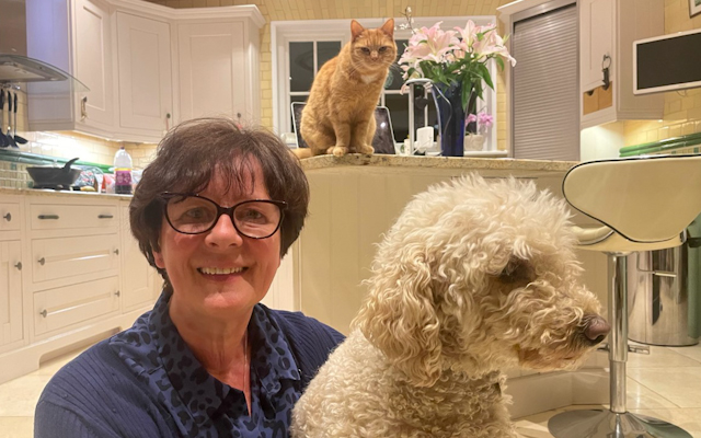 Clare Addison pictured with her cat and her dog.