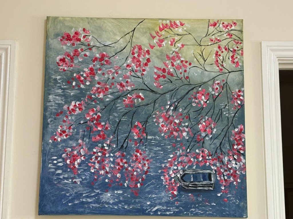 One of Kanti Khanna's paintings - pink flowers on a blue background